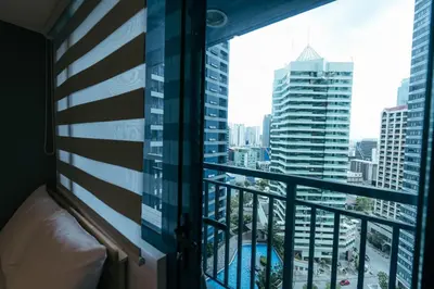 a balcony with a view of a city at Modern Living 5 with Fast Wifi and Netflix in Manila