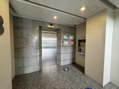 a elevator with a door in a building at The Circuit Manor Hotel near Ayala Malls Circuit in Manila