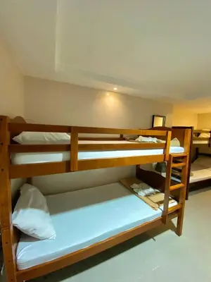 a group of bunk beds in a room at Casa Verde Hotel & Events Center in Imus