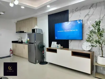 a kitchen with a tv on a wall at Newly opened near MOA & Airport with PS4 and karaoke in Manila