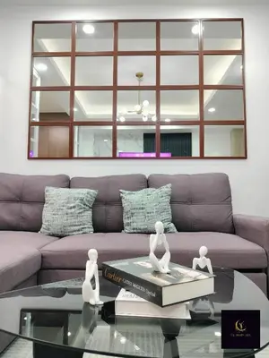 a living room with a couch and a glass table at Newly opened near MOA & Airport with PS4 and karaoke in Manila