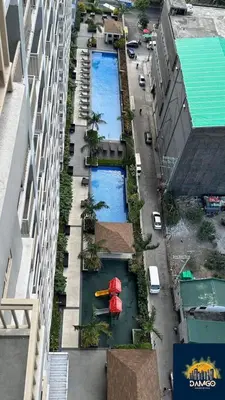 an aerial view of a city street with a building at ck staycation coast residence in Manila