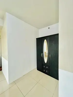 a black door with a round window in a room at SGG Place 2 Bedroom Shell Residences Mall of Asia Near NAIA in Manila