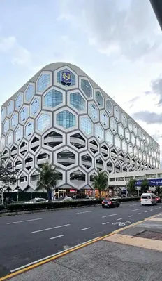 a building with a lot of windows on a street at SGG Place 2 Bedroom Shell Residences Mall of Asia Near NAIA in Manila