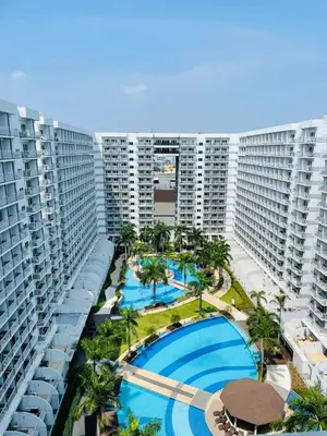 an aerial view of an apartment complex with a swimming pool at Shell Residences - Rhoi in Manila