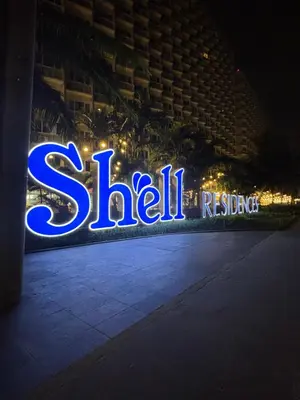 a lit up sign for a show in a building at Shell Residences - Rhoi in Manila