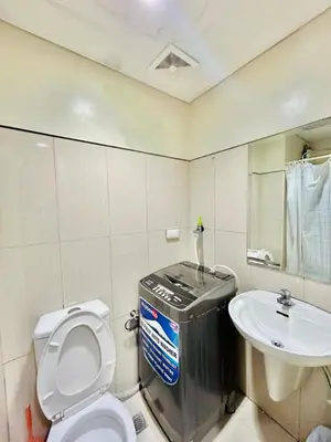 a bathroom with a toilet and a sink at 1BR Affordable Room infront of Mall of Asia Near Airport in Manila