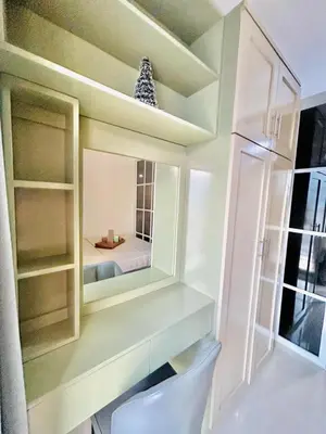 a small kitchen with a mirror and a refrigerator at 1BR Affordable Room infront of Mall of Asia Near Airport in Manila