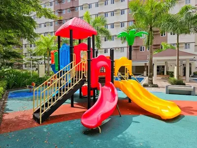 a playground in a park with a slide at Meraki Stays - ETANA - SMDC Hope Residences in Trece Martires
