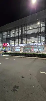 a large building at night with a street light at SGG Manila 2Bedroom MOA View - Shell Residences MOA Near Airport in Manila