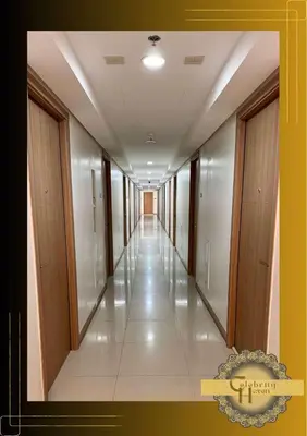 a hallway of a building with a long corridor at Celebrity Haven in Manila