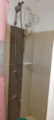 a shower with a shower head in a bathroom at La Casa Celiacay in Sangley Point Naval Station