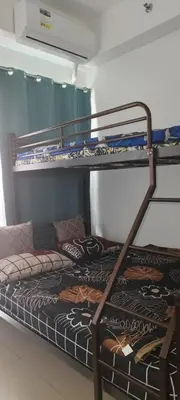 a bunk bed in a dorm room with a bunk bedutenewayangering at La Casa Celiacay in Sangley Point Naval Station