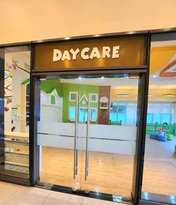 a display window of a day care store in a mall at BGC Cosy Nest Uptown Parksuites Tower 1 Near Nice Restaurants and Malls in Manila