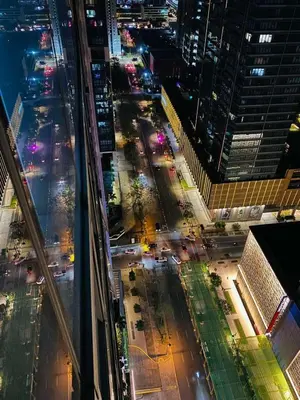 an aerial view of a city street at night at BGC Cosy Nest Uptown Parksuites Tower 1 Near Nice Restaurants and Malls in Manila