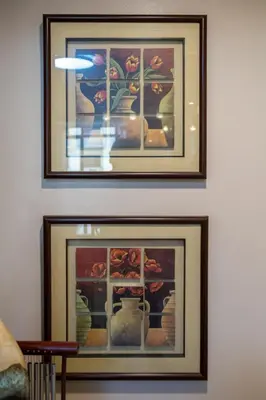 two framed pictures of vases on a wall at 2br Forbeswood Heights in BGC near St Lukes in Manila