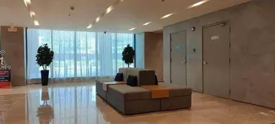 a lobby with a couch in the middle of a building at S-Residence Staycation IKEA,MOA,PICC in Manila