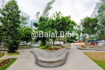 a park with a bench and a sign that reads ababil blitz at Balai Bibi at Urban Deca Homes Ortigas 3Br in Manila