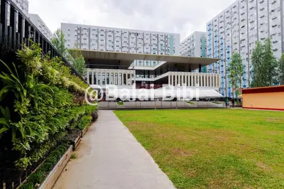 a view of a building with a lawn in front at Balai Bibi at Urban Deca Homes Ortigas 3Br in Manila