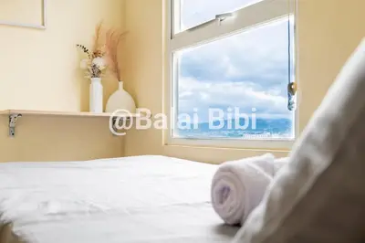 a bedroom with a bed and a window at Balai Bibi at Urban Deca Homes Ortigas 3Br in Manila