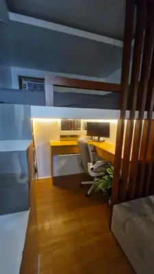 an office with a desk and a computer in a room at Cozy RC 2BR w loft Netflix Prime KTV Games in Manila