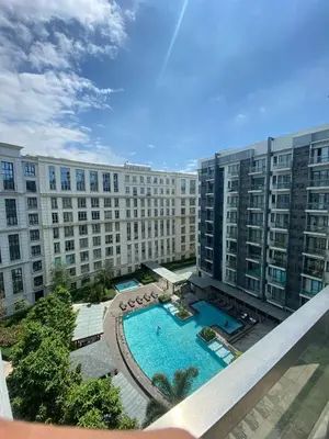 an overhead view of a large building with a swimming pool at M&N Condotel in Manila