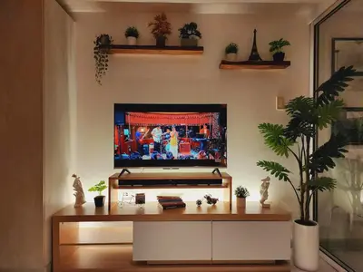a living room with a television on a wall at Azure Urban Resort-The Rustic Escape in Manila