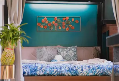 a couch in a living room with a blue wall at Modern Chic Retreat in Antipolo