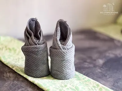 a pair of crocheted shoes sitting on a table at RE Staycations in Manila