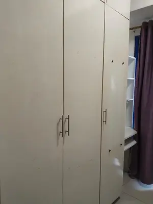 a pair of white cabinets in a room at MOA Sea Residences Condo in Manila