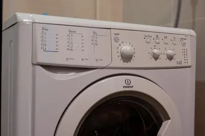 a white washing machine sitting in a room at Uptown BGC Spacious Unit - 1 Queen bed and Bunkbed in Manila