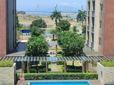 a view from the balcony of a building with a swimming pool at BS651 Room with Balcony and free pool in Manila
