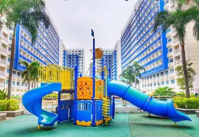 a playground with a slide in a city at Sea Residences-Booking Reservation in Manila