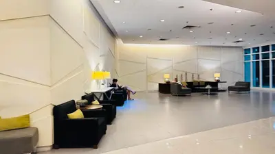 a lobby with couches and people sitting at tables at The Beacon Skyview 2BR La Suitez4307 in Manila