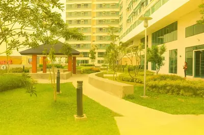 a park in front of a building with a building at The Beacon Skyview 2BR La Suitez4307 in Manila