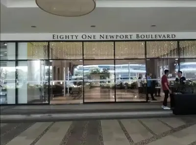 a view of the front of a flight newport building at JRM Staycation Naia T3 C66E in Manila
