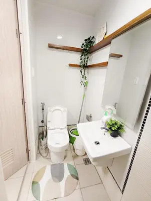 a bathroom with a toilet and a sink at Affordable Staycation in Dasma Green 2 Residence in Dasmariñas