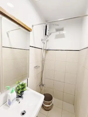 a bathroom with a shower and a sink at Affordable Staycation in Dasma Green 2 Residence in Dasmariñas