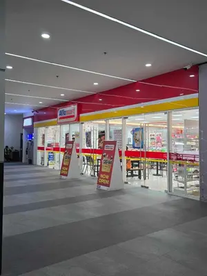 a store with tables and chairs in a building at SMDC Red Residences Makati w own parking slot in Manila