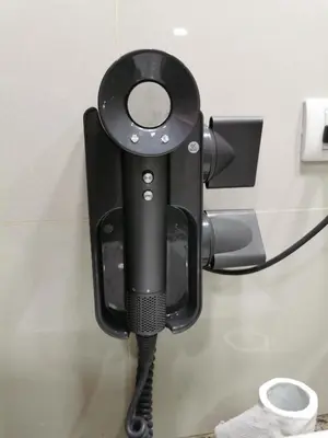 a black security camera attached to a wall at Bayshore Staycation in Manila