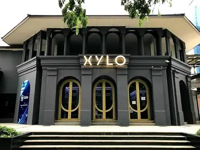 a black building with a xlvo sign on it at Spacious Modern Suites with Amazing City View in Manila