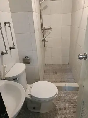 a bathroom with a toilet and a sink at A place to relax & have privacy in Manila