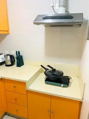 a frying pan sitting on top of a kitchen counter at He Condotel Blessed in Manila
