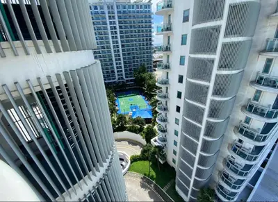 an aerial view of two tall buildings and a pool at 2BR condo Azure Netflix, Karaoke & Board games in Manila