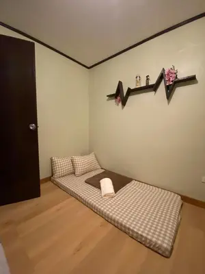 a dog bed in a corner of a room at Casa Amaya RNR Transient House in Tanza