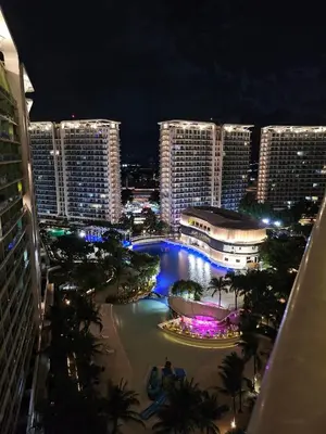 a view of a city at night with tall buildings at Quick Stay PH in Manila