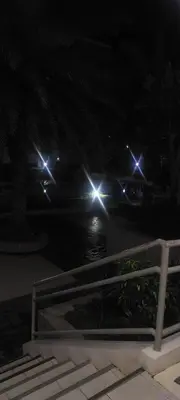 a night time view of a street with lights at Florida sun condo in Dasmariñas