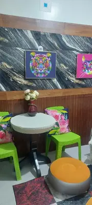 a table and two chairs and a table and a table and chairs at Florida sun condo in Dasmariñas