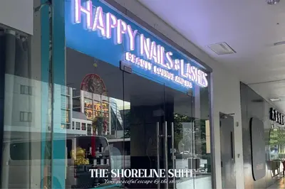 a store front with a sign that reads happy manish kisses at The Shoreline Suite at Shore 3 Residences MOA Pasay in Manila