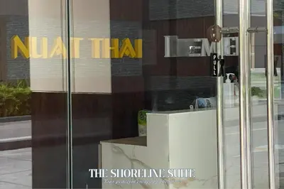 a sign on the side of a building at The Shoreline Suite at Shore 3 Residences MOA Pasay in Manila